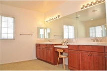 Master Bathroom with lots of natural lighting, dual sinks, and l